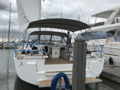 Beneteau Oceanis 51.1, model with NO ARCH, Bimini and zipped Sprayhood Connector rear side view 2