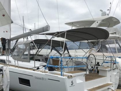 Beneteau Oceanis 51.1, model with NO ARCH, Bimini and zipped Sprayhood Connector rear side view 1