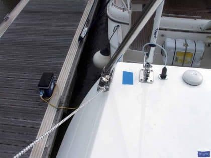 Sealine F42 bimini with a curved design, featuring Sunbrella fabric and stainless steel frame for flybridge protection.