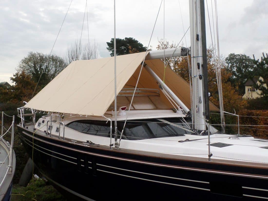 Tecsew boom tent fitted on a yacht, offering cockpit protection with premium marine fabric and custom fit.