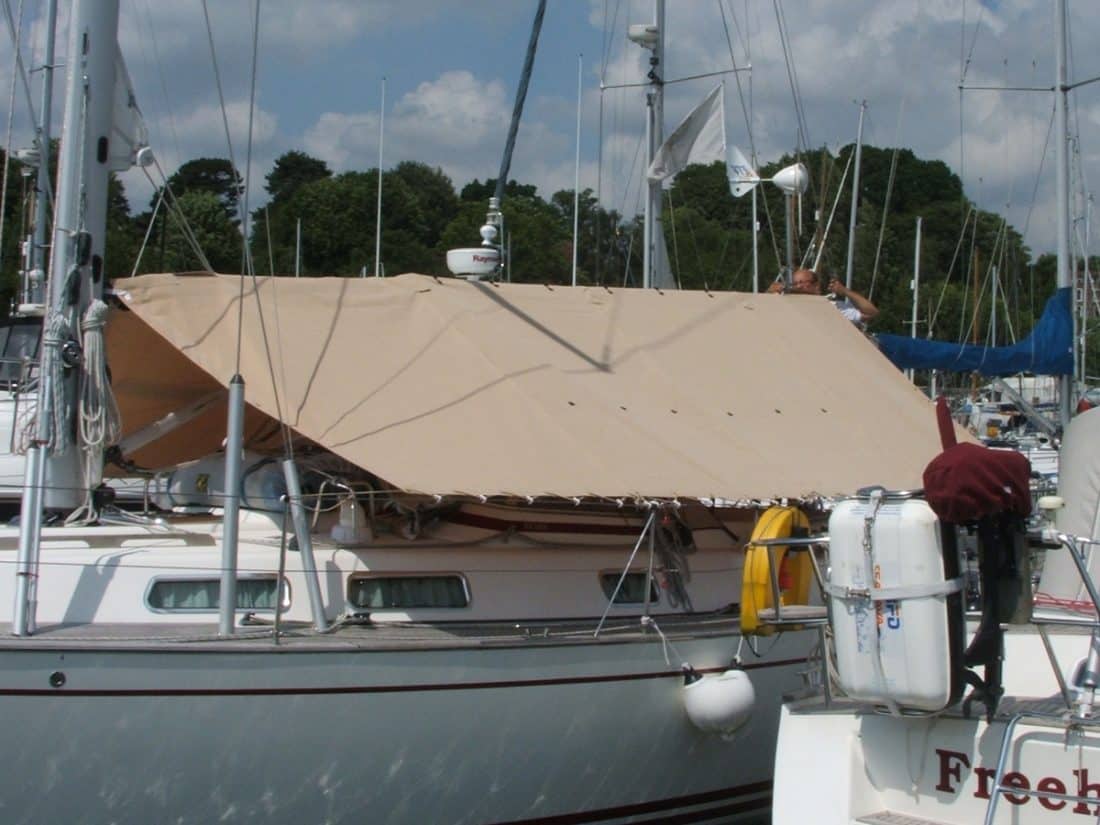 Side view of custom-fitted Tecsew boom tent, offering UV-resistant and weatherproof cockpit coverage.