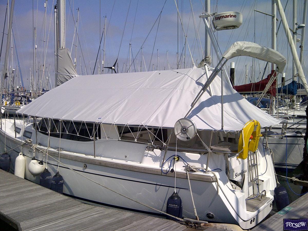 Interior of yacht cockpit under a Tecsew boom tent, providing shade and protection with a tailored design.