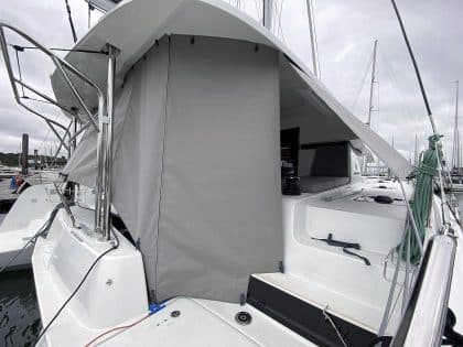 Lagoon 42 with custom cockpit shade panels installed, providing sun protection and versatility.
