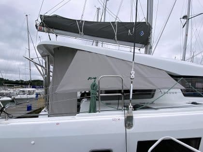 Lagoon 42 with custom cockpit shade panels installed, providing sun protection and versatility.