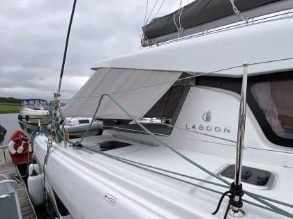 Lagoon 42 with custom cockpit shade panels installed, providing sun protection and versatility.
