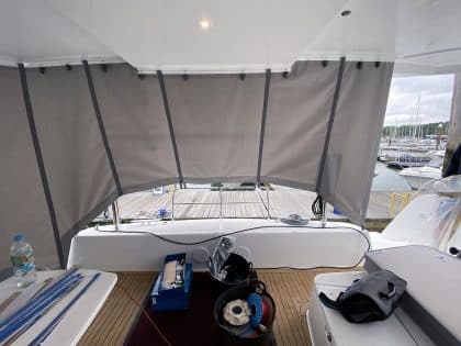 Lagoon 42 with custom cockpit shade panels installed, providing sun protection and versatility.