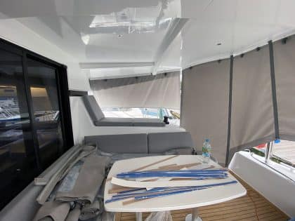 Lagoon 42 with custom cockpit shade panels installed, providing sun protection and versatility.