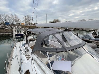 Full view of a Moody 54 yacht with a newly designed sprayhood featuring a modern framework and premium fabric.