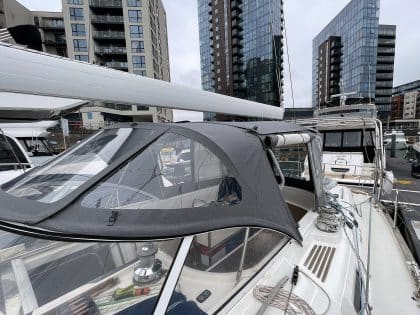 Full view of a Moody 54 yacht with a newly designed sprayhood featuring a modern framework and premium fabric.