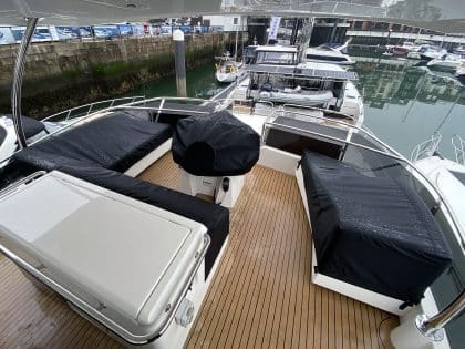 Aquila 44 seating and console covers crafted with TopNotch 1S fabric for lightweight and durable protection.