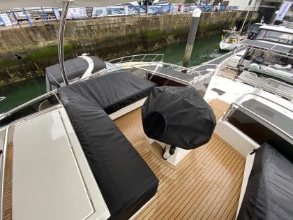 Aquila 44 seating and console covers crafted with TopNotch 1S fabric for lightweight and durable protection.