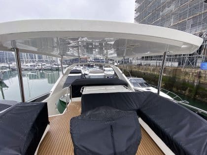 Aquila 44 seating and console covers crafted with TopNotch 1S fabric for lightweight and durable protection.