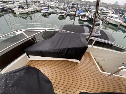 Aquila 44 seating and console covers crafted with TopNotch 1S fabric for lightweight and durable protection.