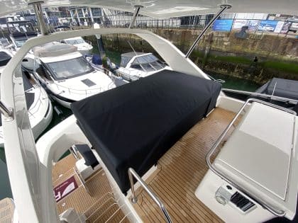 Aquila 44 seating and console covers crafted with TopNotch 1S fabric for lightweight and durable protection.