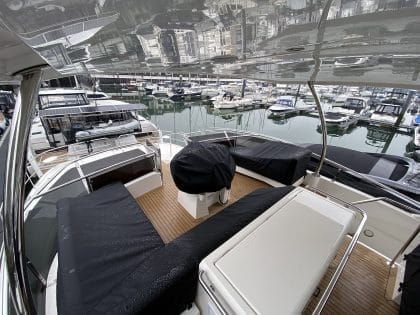 Aquila 44 seating and console covers crafted with TopNotch 1S fabric for lightweight and durable protection.