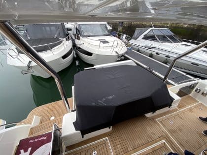 Aquila 44 seating and console covers crafted with TopNotch 1S fabric for lightweight and durable protection.