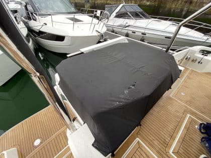 Aquila 44 seating and console covers crafted with TopNotch 1S fabric for lightweight and durable protection.