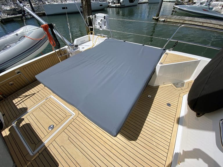 Jeanneau 55 cushion covers in Odyssey Charcoal fabric for sunbathing area and table.