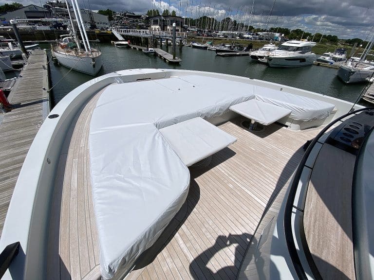 Bluegame X60 forward cushion covers in Stamoid Light fabric, Pearl Grey, with a roll-back access flap for convenience