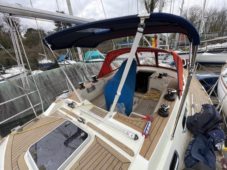 Westerly Corsair with a Tecsew 3-bar bimini providing extended sun protection and a durable stainless frame.